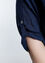 Lange, unifarbene Bluse mit Stickerei vorne und Pailletten